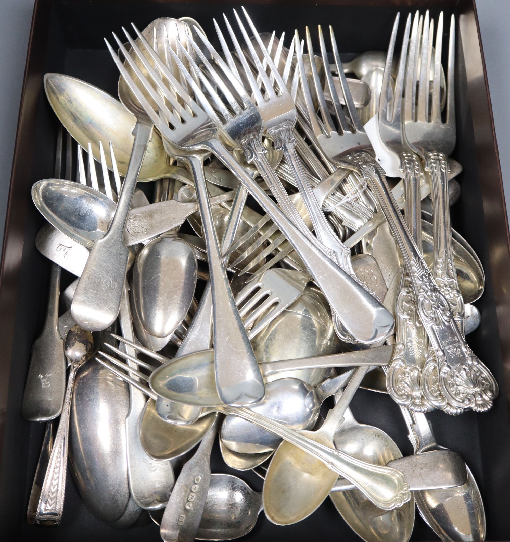 Assorted silver flatware.